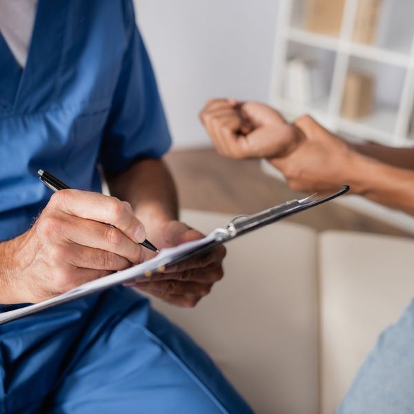 chiropractor with clipboard