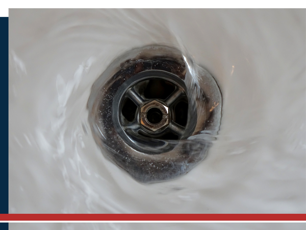 Water swirling down a drain