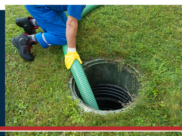 Man holding a septic pump in a septic tank