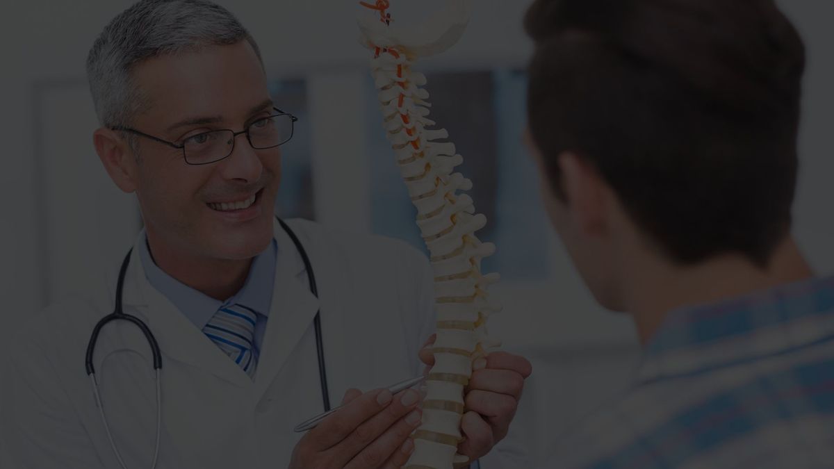 doctor discussing spine services with a patient.