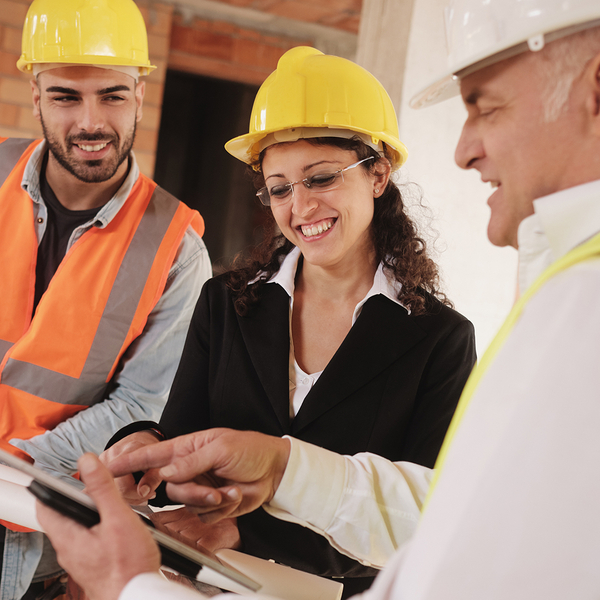 Image of home owners talking to a home builder