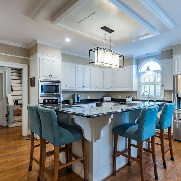 kitchen with island and blue chairs