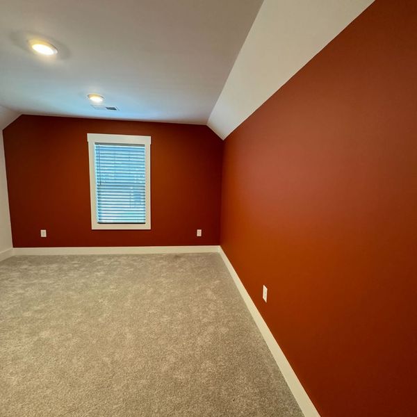 red painted walls with tan carpet