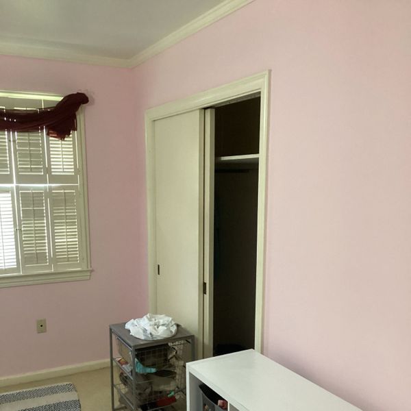 Bedroom with pale pink painted walls