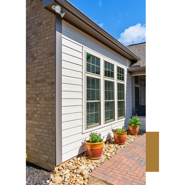 a home exterior with wood siding and brick