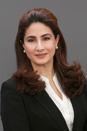 Professional headshot of a woman wearing a blazer