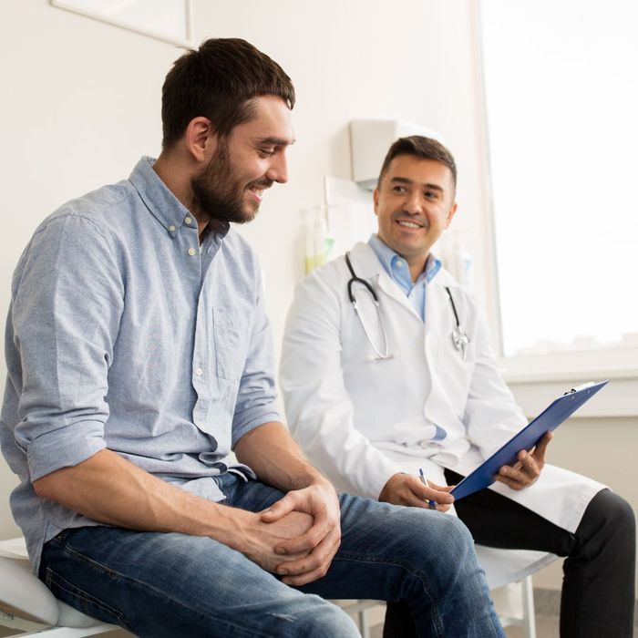 doctor with male patient in exam room