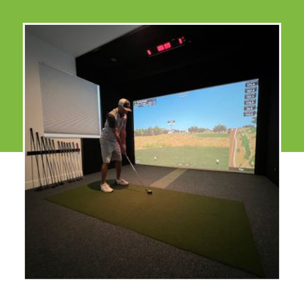 man using virtual golf simulator