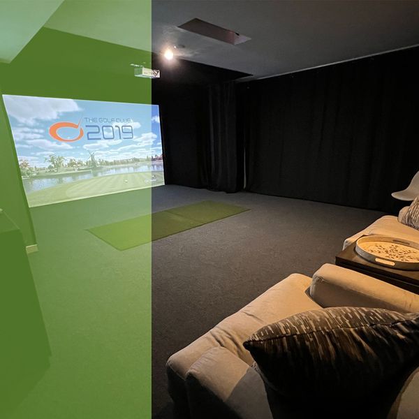 photo of a room with a golf simulator