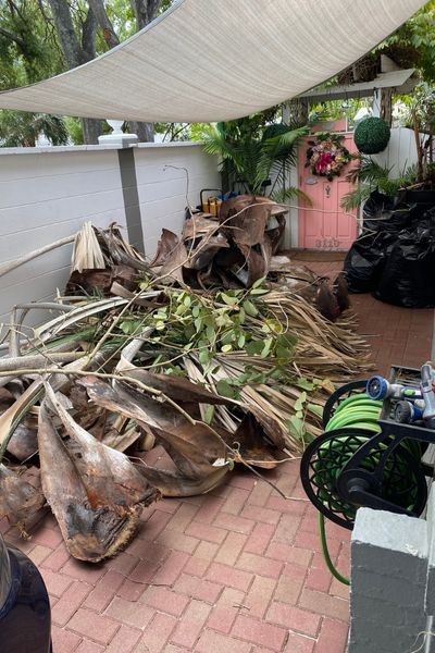 Landscaping debris piled up on a patio.