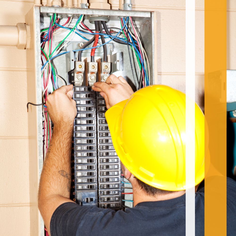 electrician working on an electrical panel