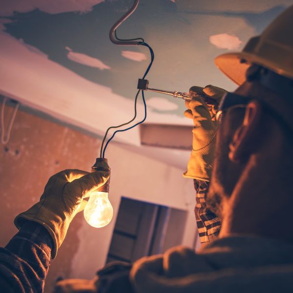 electrician installing light