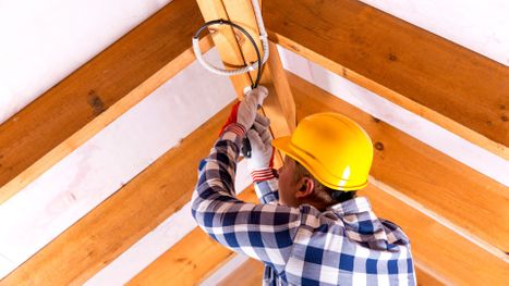 electrician working on ceiling light