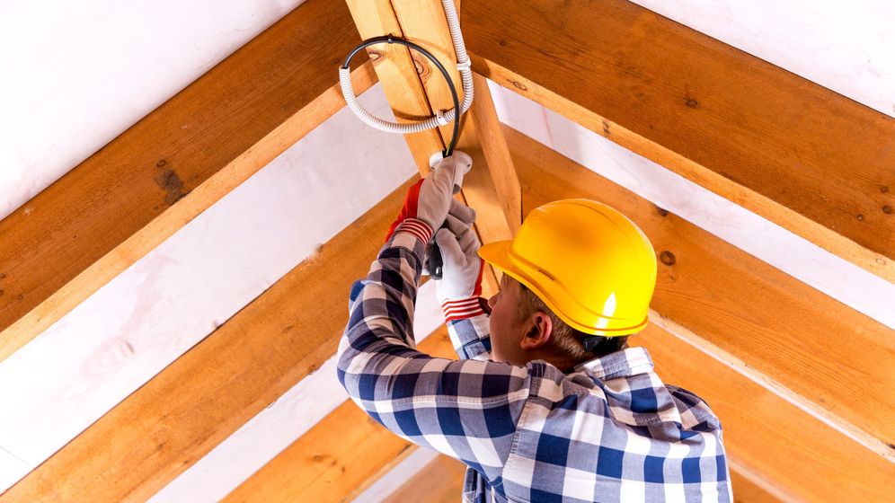 electrician working on ceiling light