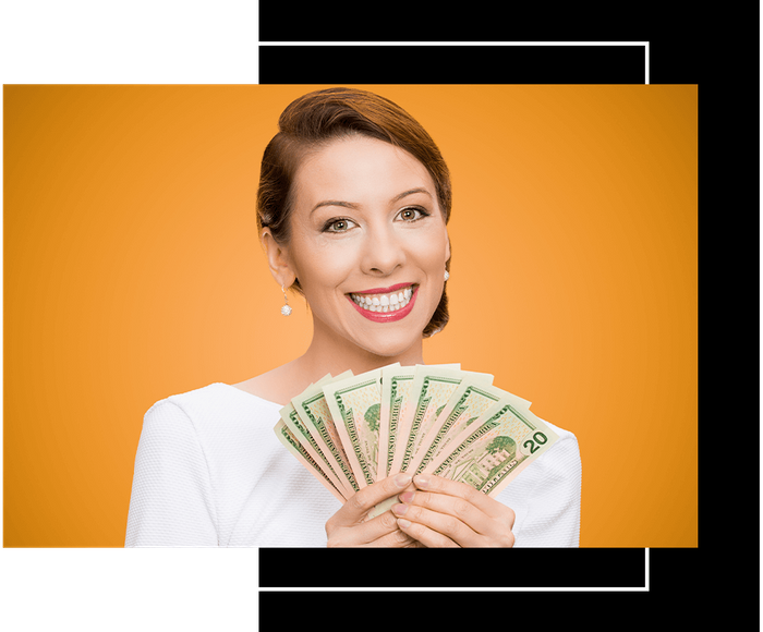 a woman holding a stack of 20 dollars