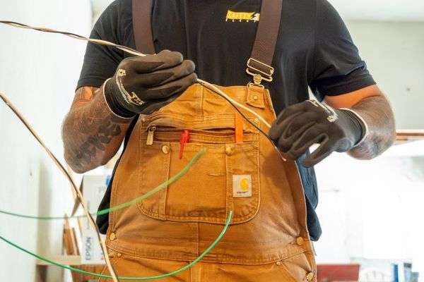 electrician running new wire for home project 