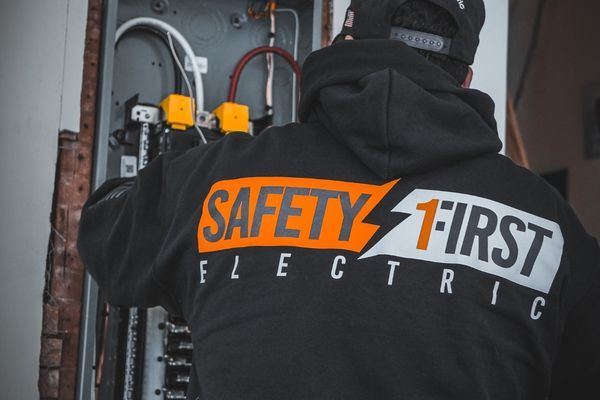 Safety First employee working on elecrical panel 