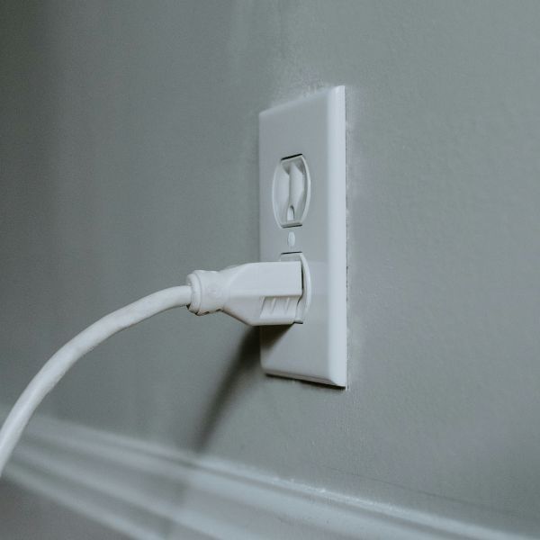 cord plugged in wall outlet