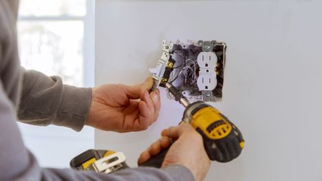 electrician installing an outlet