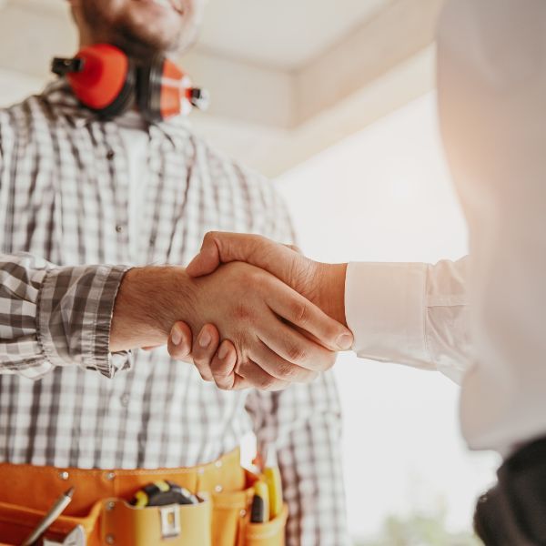 electrician and client shaking hands