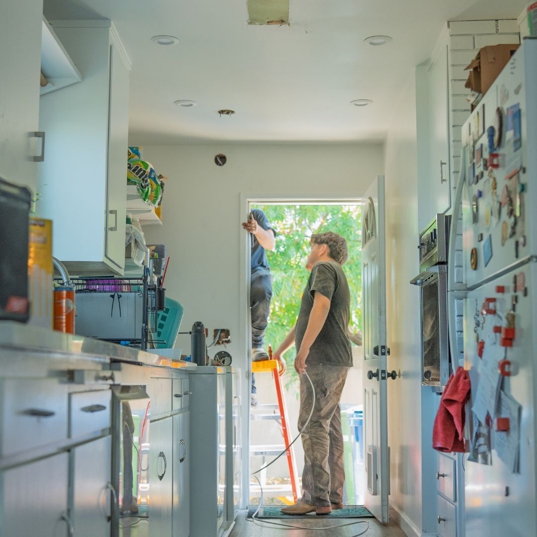 electricians working on residential wiring