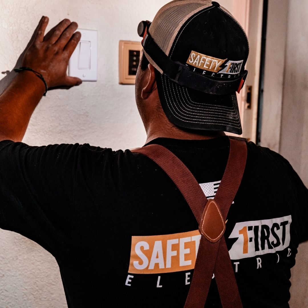 electrician working near outlet