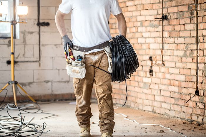 Electrician with wires in hand