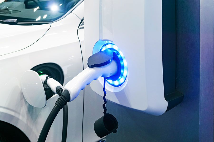 Electric car charging port charging a car