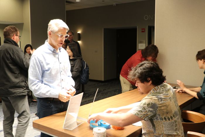 Staff welcoming guest during check-in