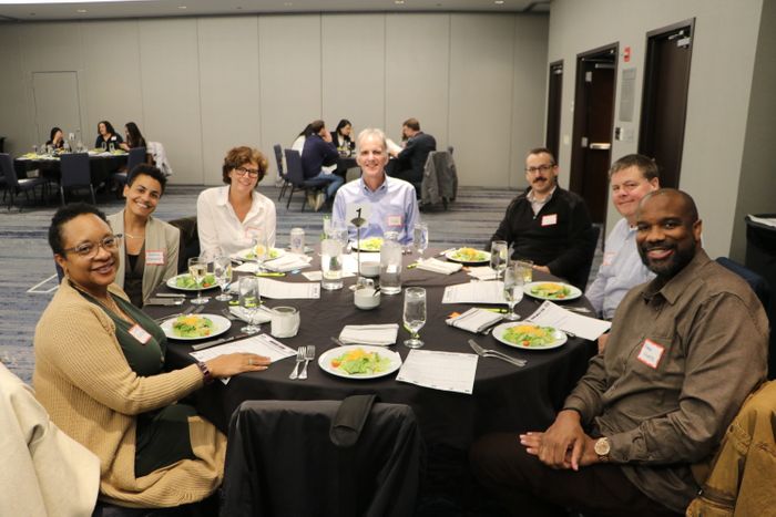 Group of guests seated at dinner table