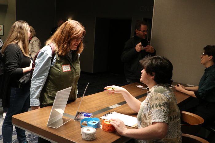 Guests being welcomed at front desk