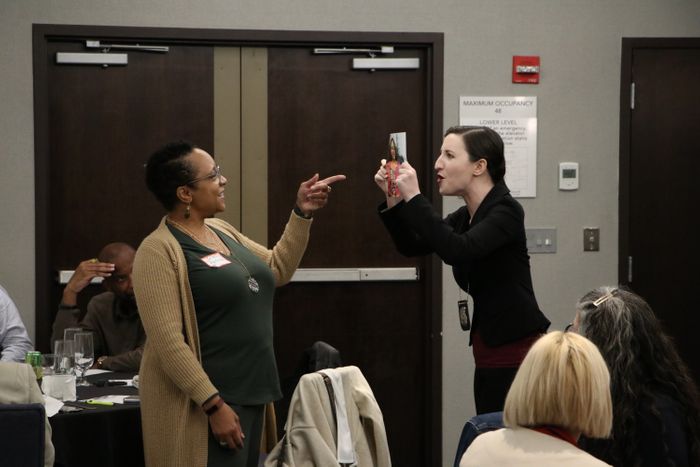 Guests Engaged in a Murder Mystery Party Experience