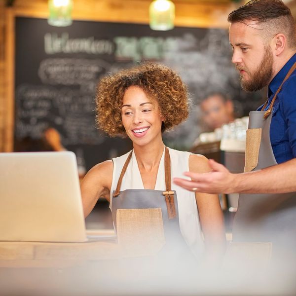 business owners looking at energy bill