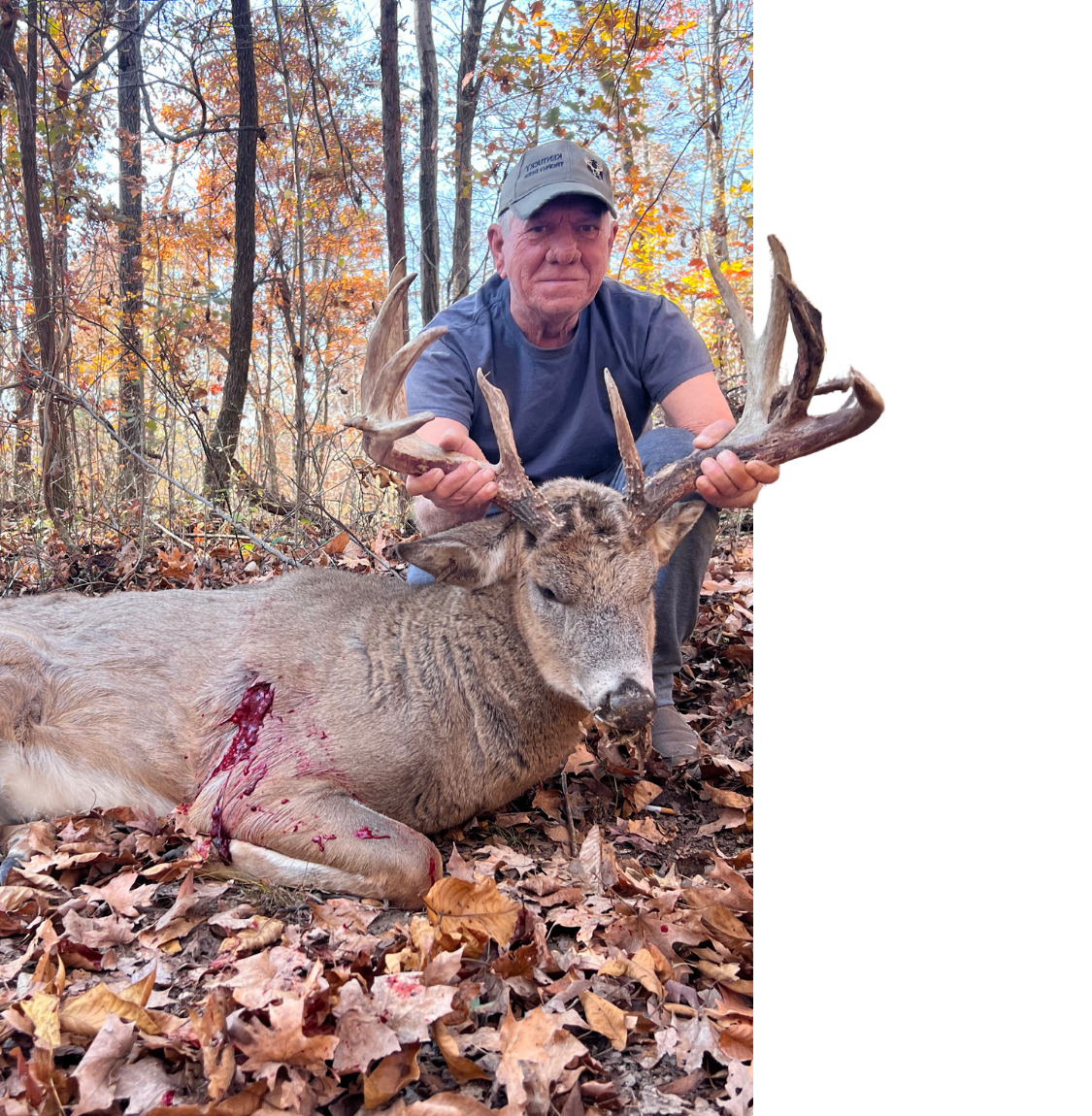 A man with a whitetail deer he hunted.