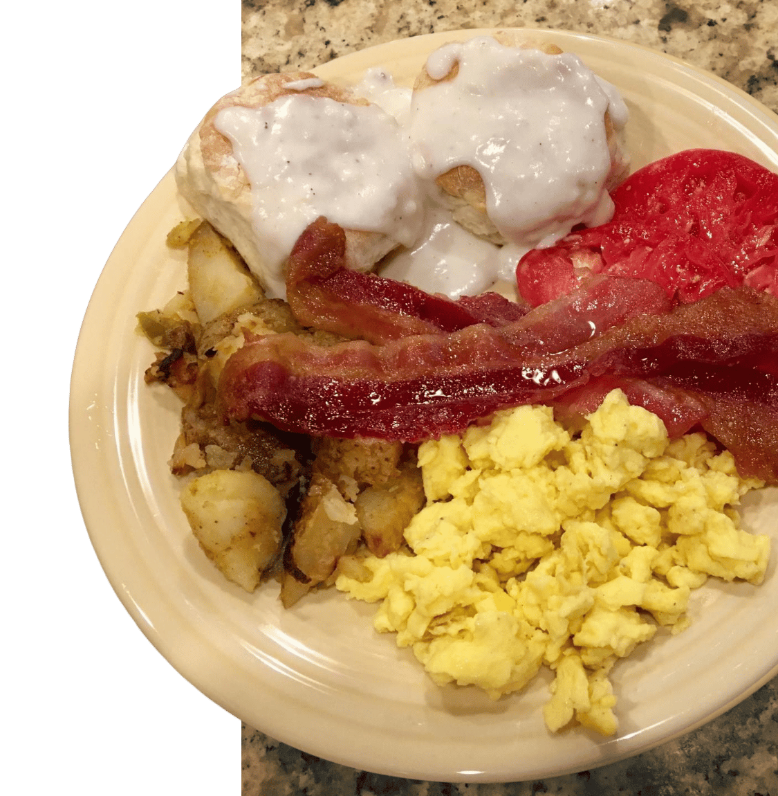 biscuits and gravy with eggs, potatoes, and bacon