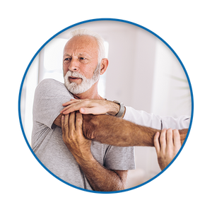 photo of older man working with chiropractor on his shoulder