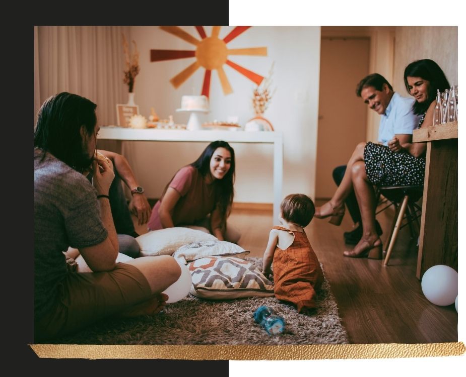 A happy family gathering in a freshly renovated living room, highlighting the lifestyle benefits of a home remodel.