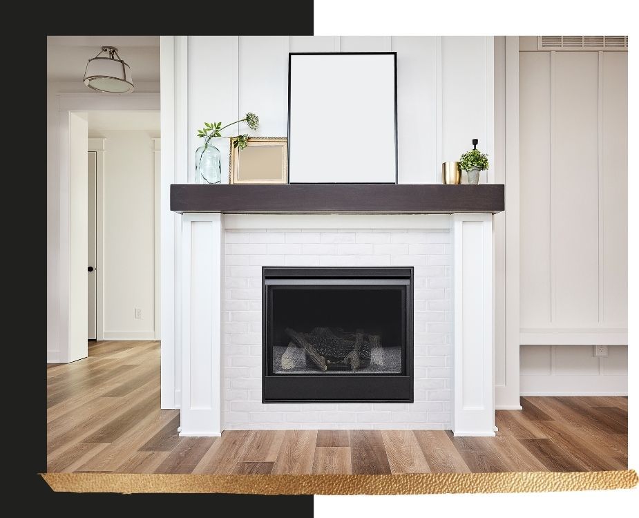 Modern fireplace design with a clean white shiplap chimney breast, a dark wood mantel, and professional white brick masonry.