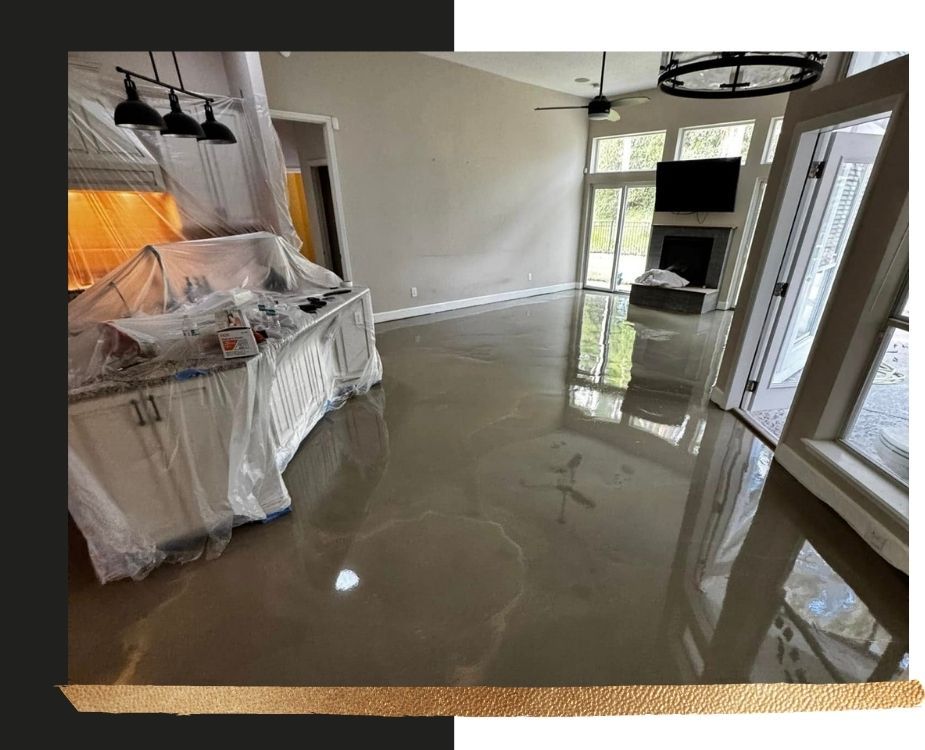 High-gloss polished concrete floor installation in a residential living space, showcasing a seamless, reflective finish.