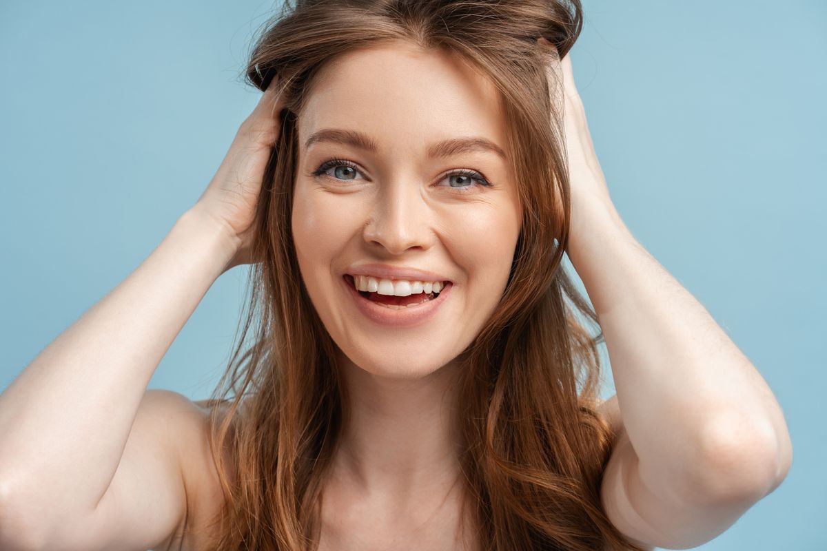 beautiful-smiling-woman-touching-shiny-hair-isolat-2023-10-02-04-09-47-utc.jpg
