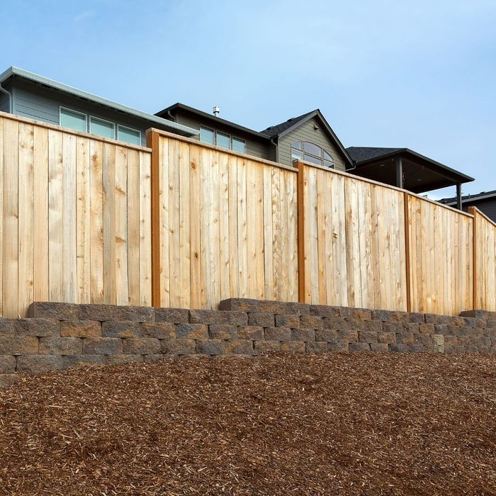 wooden fence with mulch nearby