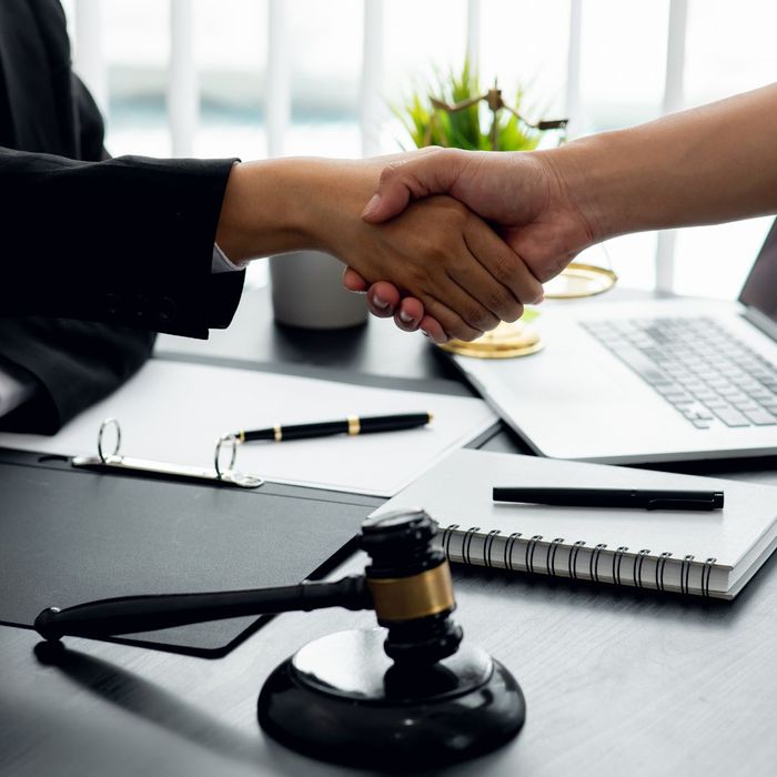 attorney shaking hands with client