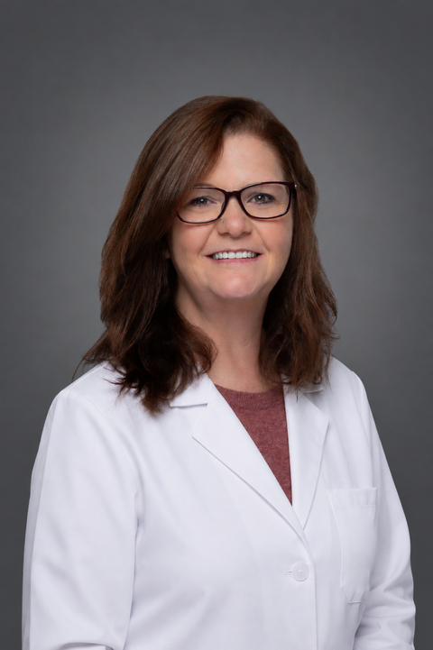 Melissa Paul white lab coat.png