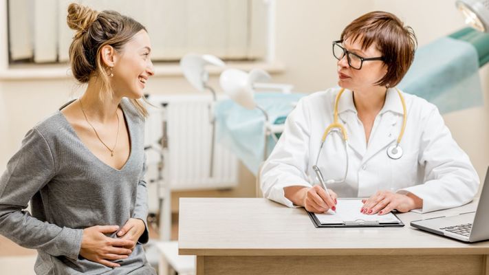 gynecologist talking to her patient