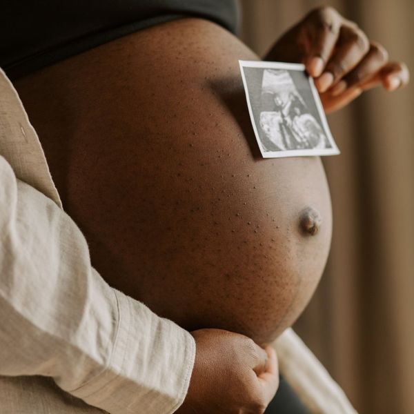 pregnant woman holding an ultrasound