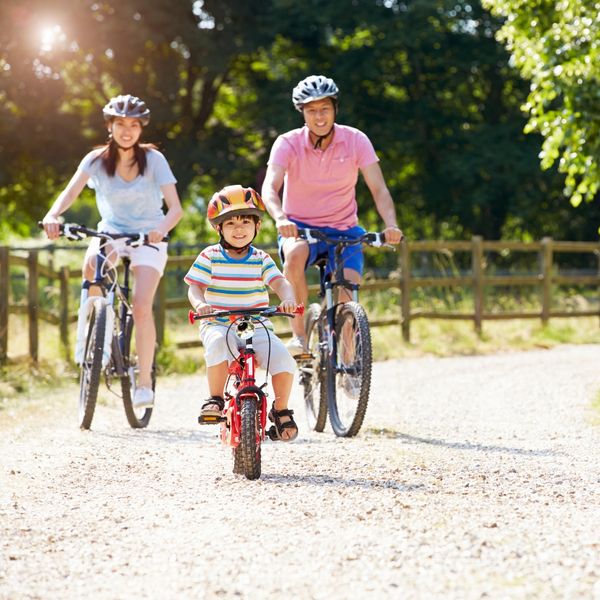 A diverse family engaging in healthy activities outdoors, representing preventative care. A diverse family engaging in healthy activities outdoors, representing preventative care.
