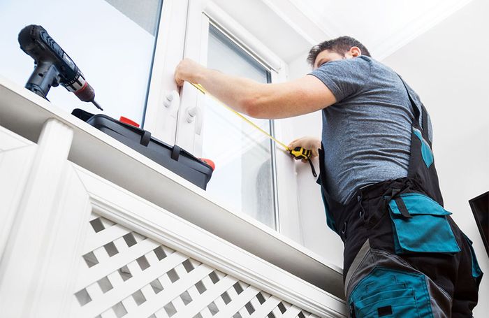 handyman measuring with tape