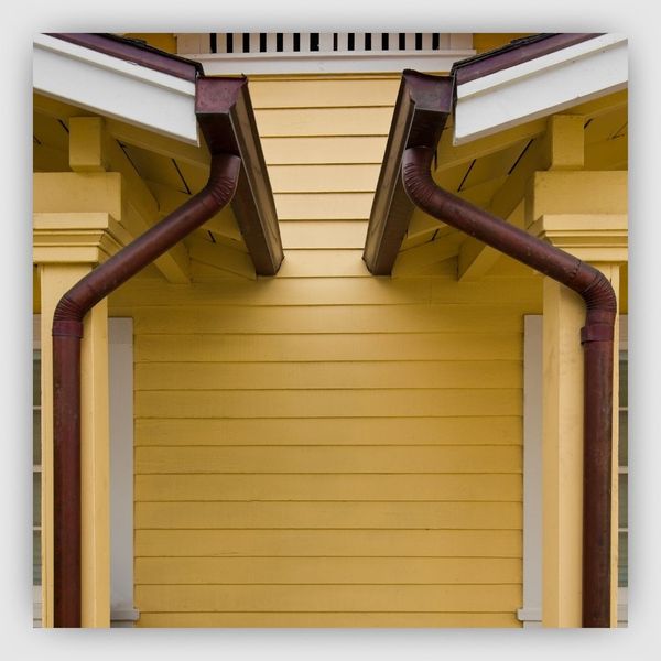 Copper gutters between porch roofs