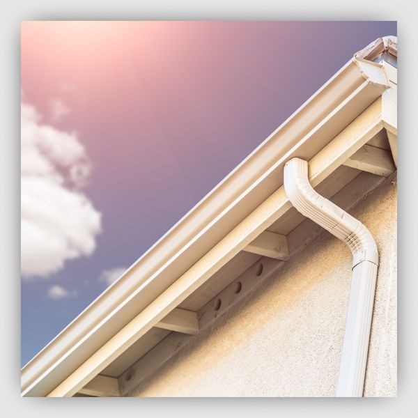 Sun shining on white gutters