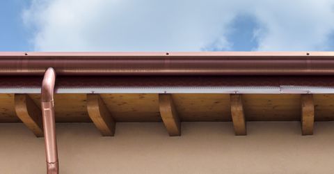 Copper gutter with sky in background